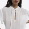 The Kooples Donna À VOLANTS - Camicetta - Off White -Vendite The Kooples db6ab265ee0b477897713121fd06f46e